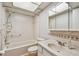 Cozy bathroom with combined shower-tub, and tiled vanity at 11200 102Nd Ave # 33, Seminole, FL 33778