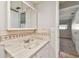 Bathroom with a marbled vanity, tiled backsplash, and ample lighting at 11200 102Nd Ave # 33, Seminole, FL 33778