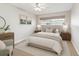 Comfortable bedroom with neutral tones, plush bedding, and ample natural light from the window at 11200 102Nd Ave # 33, Seminole, FL 33778