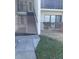 Condo building entrance with stairs leading to the second floor at 2688 Pine Ridge N Way # D1, Palm Harbor, FL 34684