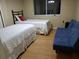 Bedroom with twin beds and sofabed at 2001 Rain Dance Pl, Brandon, FL 33510