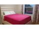 Bedroom with full-size bed and window at 2001 Rain Dance Pl, Brandon, FL 33510