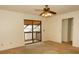 Bedroom with balcony access and ceiling fan at 5401 Bayshore Blvd # O, Tampa, FL 33611