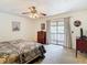 Main bedroom with king-size bed and access to a private balcony at 5401 Bayshore Blvd # O, Tampa, FL 33611