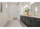 Elegant bathroom with double vanity, large mirror, and separate shower at 4943 Ribbon Rock Cv, Lakewood Ranch, FL 34211