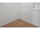 Spacious walk-in closet with wire shelving and hardwood floors at 4943 Ribbon Rock Cv, Lakewood Ranch, FL 34211