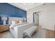 Main bedroom with king-size bed and an ensuite bathroom at 4943 Ribbon Rock Cv, Lakewood Ranch, FL 34211