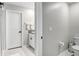 Small bathroom with toilet, sink, and vanity at 16764 Delia St, Wimauma, FL 33598