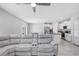 Spacious living room with large sectional sofa and open floor plan at 16764 Delia St, Wimauma, FL 33598