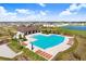 Resort-style pool with expansive sundeck and community clubhouse at 16764 Delia St, Wimauma, FL 33598