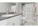 Main bathroom with tub shower and vanity at 16764 Delia St, Wimauma, FL 33598