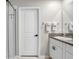 Bathroom with shower, vanity, and white cabinets at 16764 Delia St, Wimauma, FL 33598