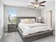 Bright bedroom featuring a king-size bed and neutral decor at 16764 Delia St, Wimauma, FL 33598