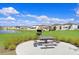 Relaxing picnic area with grill and lake views at 16764 Delia St, Wimauma, FL 33598