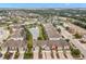 Aerial view showcasing townhouses and a pond at 5018 Sunnyside Ln, Bradenton, FL 34211