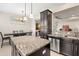 Modern kitchen with an island, stainless steel appliances, and dark wood cabinets at 5018 Sunnyside Ln, Bradenton, FL 34211