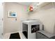 Convenient laundry room with washer, dryer, and shelving at 5018 Sunnyside Ln, Bradenton, FL 34211