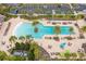 Community pool with palm trees and lounge chairs at 5018 Sunnyside Ln, Bradenton, FL 34211