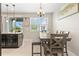Bright dining area with a large wooden table and bench seating at 5018 Sunnyside Ln, Bradenton, FL 34211