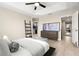 Main bedroom with platform bed, large TV, and walk-in closet at 5018 Sunnyside Ln, Bradenton, FL 34211