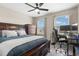 Bright bedroom with a large bed, desk, and window at 5018 Sunnyside Ln, Bradenton, FL 34211