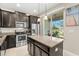 Modern kitchen with stainless steel appliances and granite countertops at 5018 Sunnyside Ln, Bradenton, FL 34211