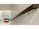 Dark wood handrail detail on modern staircase at 5018 Sunnyside Ln, Bradenton, FL 34211