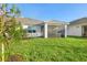 Spacious backyard with a screened porch and lush green lawn at 11269 Boundless Ter, Venice, FL 34293