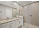 Elegant bathroom with dual sinks, a large shower, and modern white cabinets at 11269 Boundless Ter, Venice, FL 34293