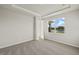 Bright bedroom with carpet flooring and a large window offering a beautiful view at 11269 Boundless Ter, Venice, FL 34293