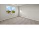 Well-lit bedroom featuring carpet flooring and a window with a scenic view at 11269 Boundless Ter, Venice, FL 34293