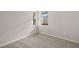 Bright bedroom with carpet flooring and a window overlooking the community at 11269 Boundless Ter, Venice, FL 34293