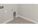 Convenient laundry room with tile flooring and built-in shelving at 11269 Boundless Ter, Venice, FL 34293