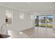 Bright living room with sliding glass doors and a water view at 11269 Boundless Ter, Venice, FL 34293