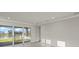 Bright living room with sliding glass doors and a water view at 11269 Boundless Ter, Venice, FL 34293