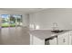 Bright living room with sliding glass doors and a water view at 11269 Boundless Ter, Venice, FL 34293