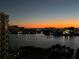 Scenic night view of the water and city lights, creating a peaceful and serene atmosphere at 690 Island Way # 812, Clearwater Beach, FL 33767
