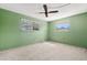 Bedroom with window, ceiling fan and neutral walls at 2747 Sand Hollow Ct, Clearwater, FL 33761