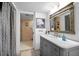 Bathroom with vanity, marble countertop, and shower at 690 Island Way # 812, Clearwater Beach, FL 33767