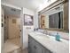 Bathroom with vanity, marble countertop, and shower at 690 Island Way # 812, Clearwater Beach, FL 33767