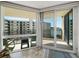 Bright living room with sliding glass doors leading to a spacious balcony at 690 Island Way # 812, Clearwater Beach, FL 33767