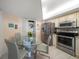 Kitchen with stainless steel appliances and breakfast nook at 690 Island Way # 812, Clearwater Beach, FL 33767
