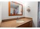 Bathroom features a granite countertop, wood cabinets and an oval sink at 690 Island Way # 812, Clearwater Beach, FL 33767