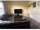Living room with sectional sofa, coffee table, and window at 5945 21St N St # 14, St Petersburg, FL 33714