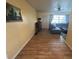 Living room with a grey sectional sofa and wood floors at 5945 21St N St # 14, St Petersburg, FL 33714