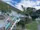 Two story building with teal accents and stairs at 5945 21St N St # 14, St Petersburg, FL 33714