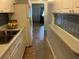Bright kitchen featuring white cabinets and a double sink at 5945 21St N St # 14, St Petersburg, FL 33714