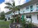 Two story building with teal accents and landscaping at 5945 21St N St # 14, St Petersburg, FL 33714