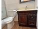 Bathroom with toilet, vanity, and shower/tub combo at 5945 21St N St # 14, St Petersburg, FL 33714