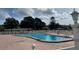 Community pool with plenty of lounge chairs at 5945 21St N St # 14, St Petersburg, FL 33714